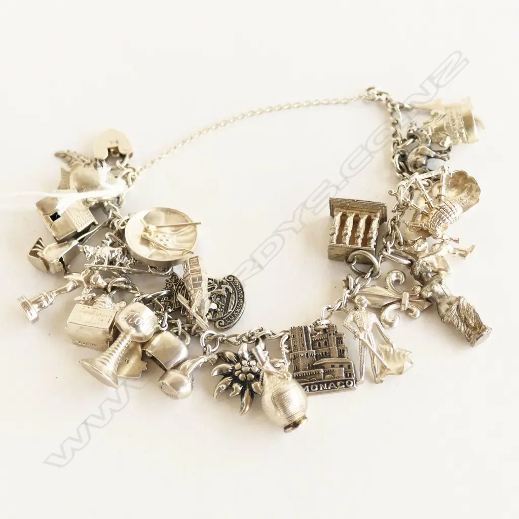 SILVER HEAVY MULTI CHARM BRACELET 63gms Image 1++
