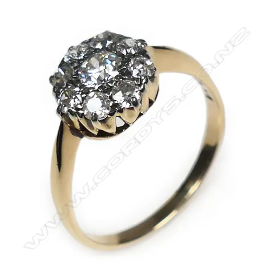 An estate 18ct gold and diamond cluster ring,