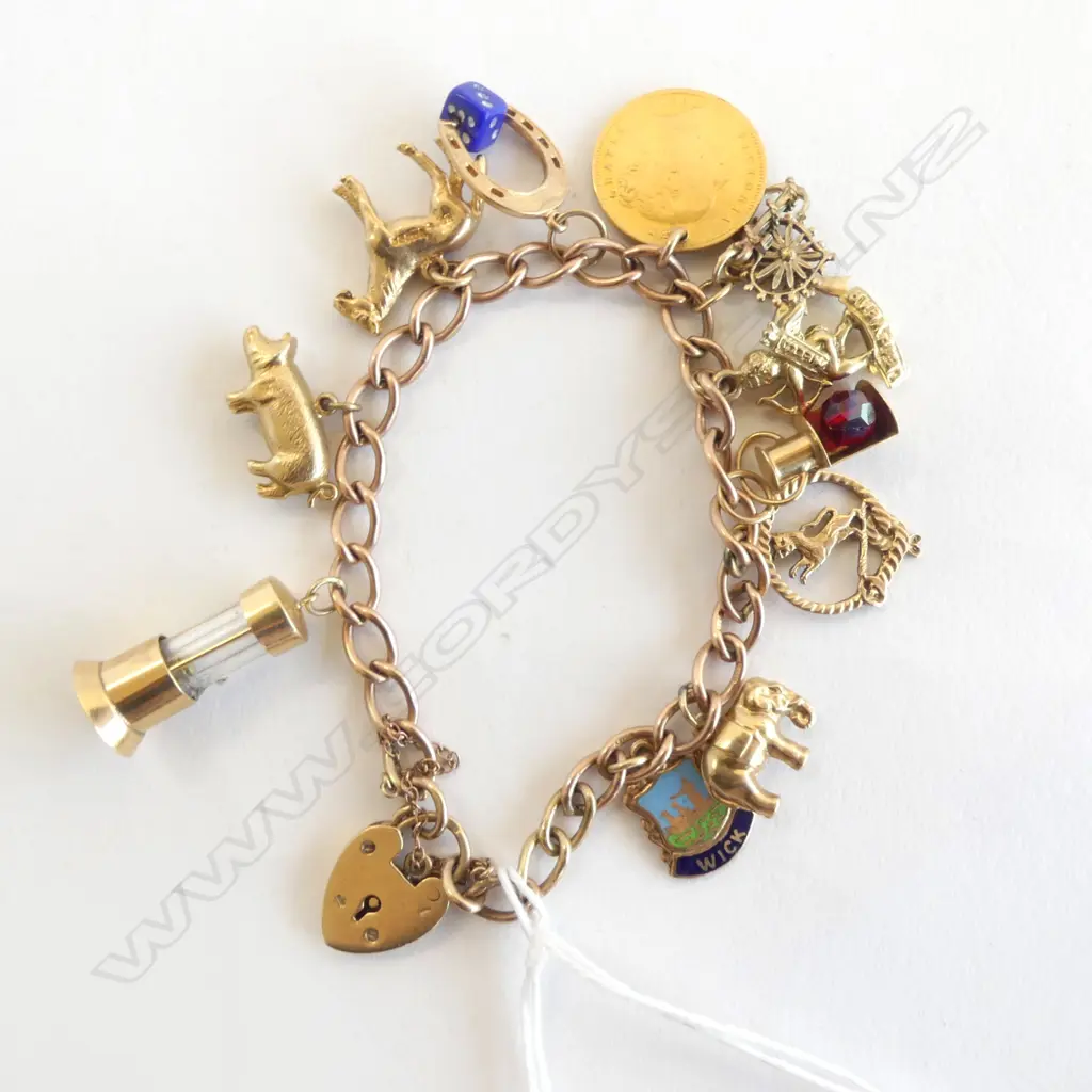 9ct gold CHARM BRACELET 10 charms incls. 1881 half sovereign 29gms Image 1++