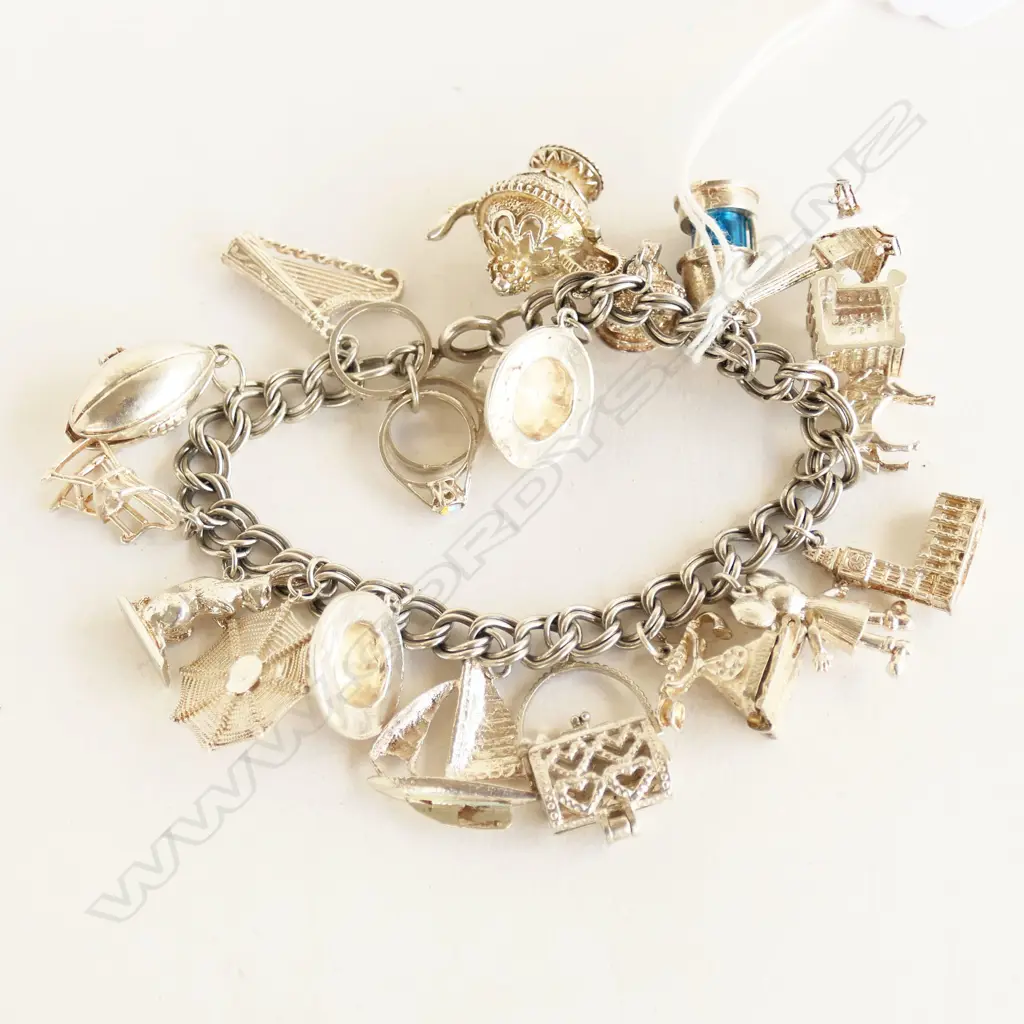 SILVER HEAVY MULTI CHARM BRACELET 75.8gms Image 1++