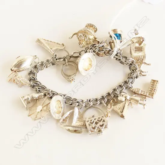SILVER HEAVY MULTI CHARM BRACELET 75.8gms