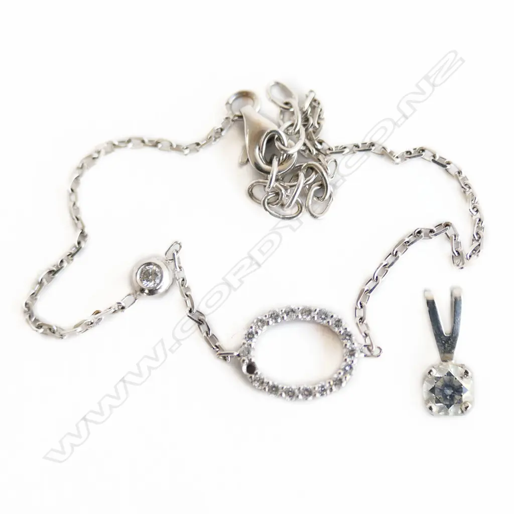 18CT WG DIAMOND BRACELET 2.1gms (STONE MISSING) 9CT WG DIAMOND PENDANT 0.4gms Image 1++