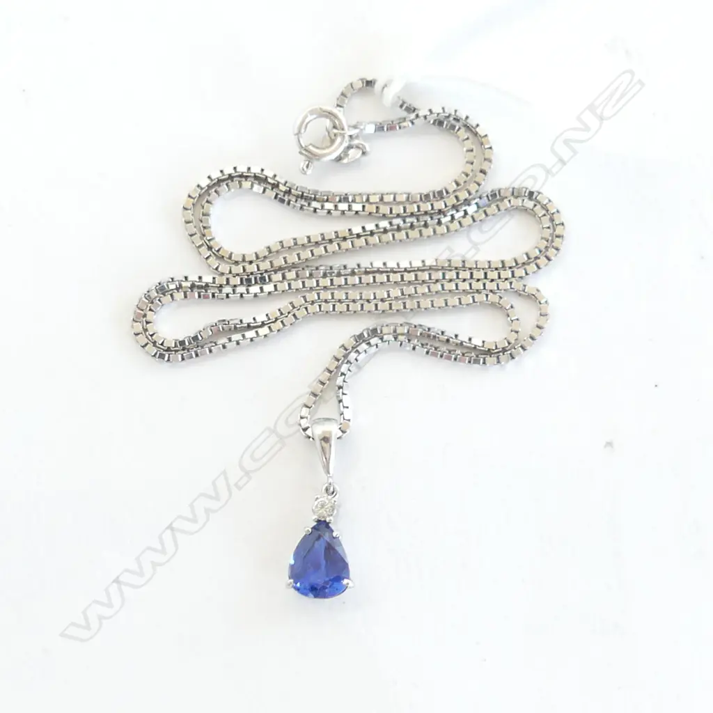 18ct WHITE GOLD PENDANT NECKLACE the pendant with pear cut SAPPHIRE of good colour below a single diamond 6.6gms Image 1++