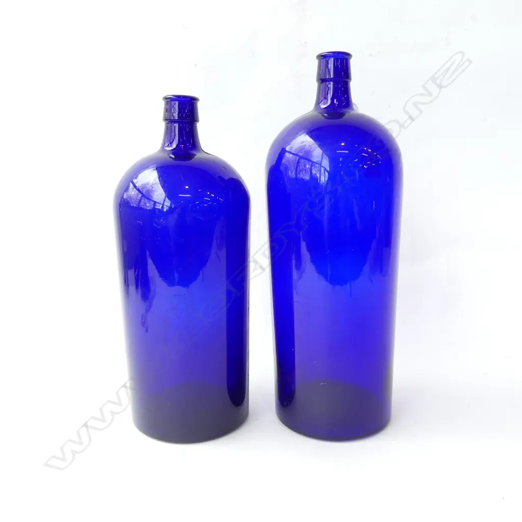 TWO LARGE BLUE POISON GLASS BOTTLES EMBOSSED 100 & 120 TO BASE, H. 320MM-360MM Image 1++
