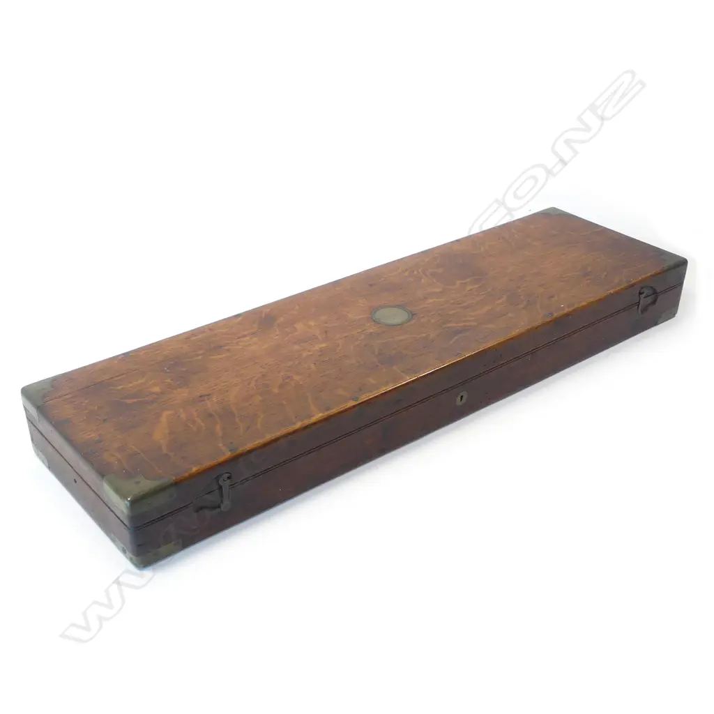 A Snider action .450 cal sporting rifle, with walnut stock, in brass bound oak fitted case Image 1++