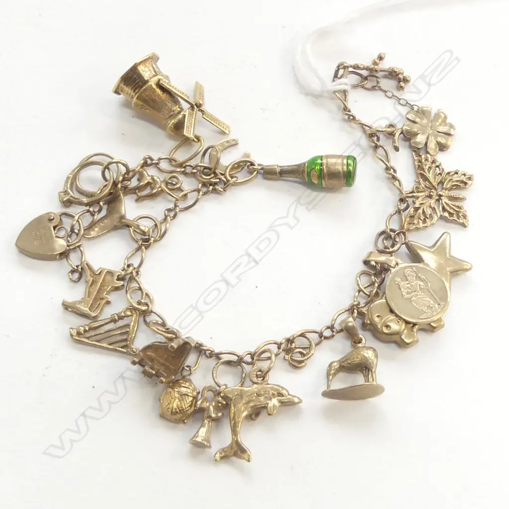9ct YELLOW GOLD CHARM BRACELET piano + dolphin + harp etc 23.3gms Image 1++