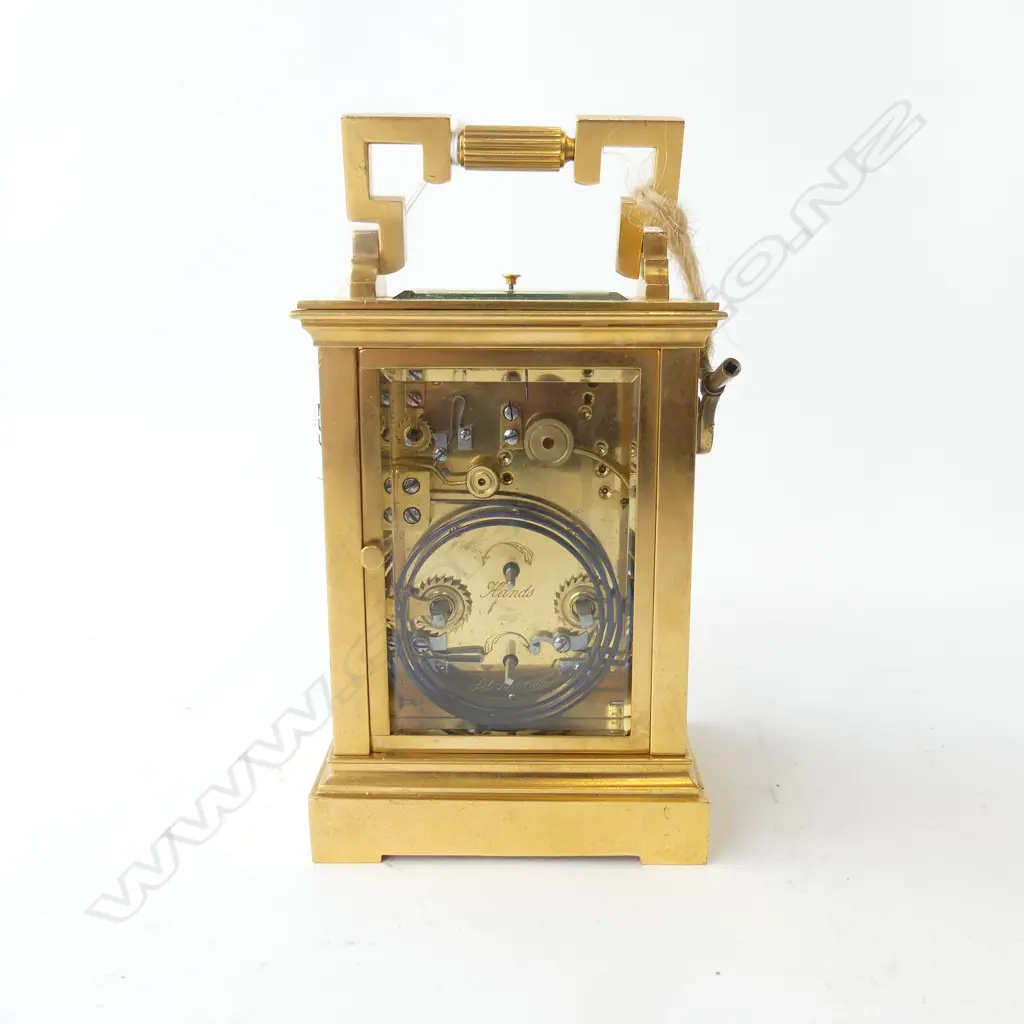 A quality 19thC French gilt brass repeater carriage clock the white enamel dial with Roman numerals, the subsidiary dial with Arabic numerals, blue highlights. The quality movement striking on a gong. Hour and half hour striking. Running, with key. H.180mm (to handle top). Image 1++