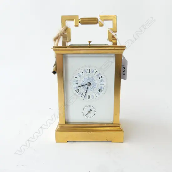 A quality 19thC French gilt brass repeater carriage clock the white enamel dial with Roman numerals, the subsidiary dial with Arabic numerals, blue highlights. The quality movement striking on a gong. Hour and half hour striking. Running, with key. H.180mm (to handle top).