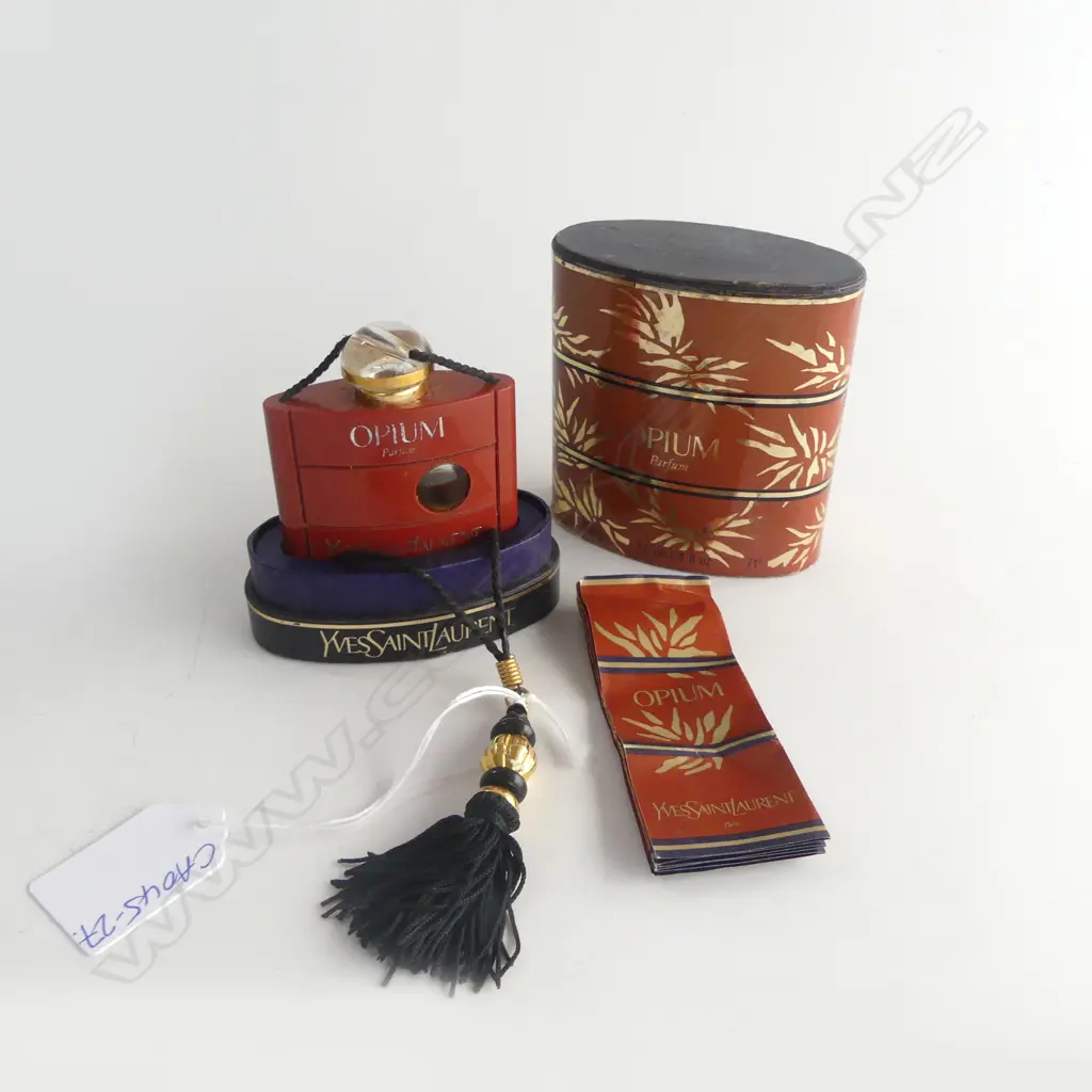 CASED OPIUM PERFUME BOTTLE w some perfume  Image 1++