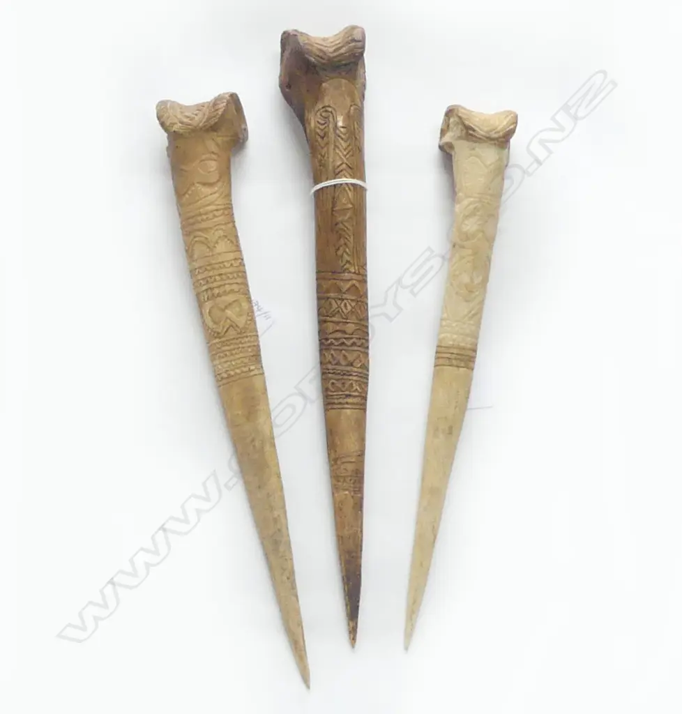 THREE P,N.G CASSOWARY BONE DAGGERS WITH INCISED DECORATION L 390 MM Image 1++