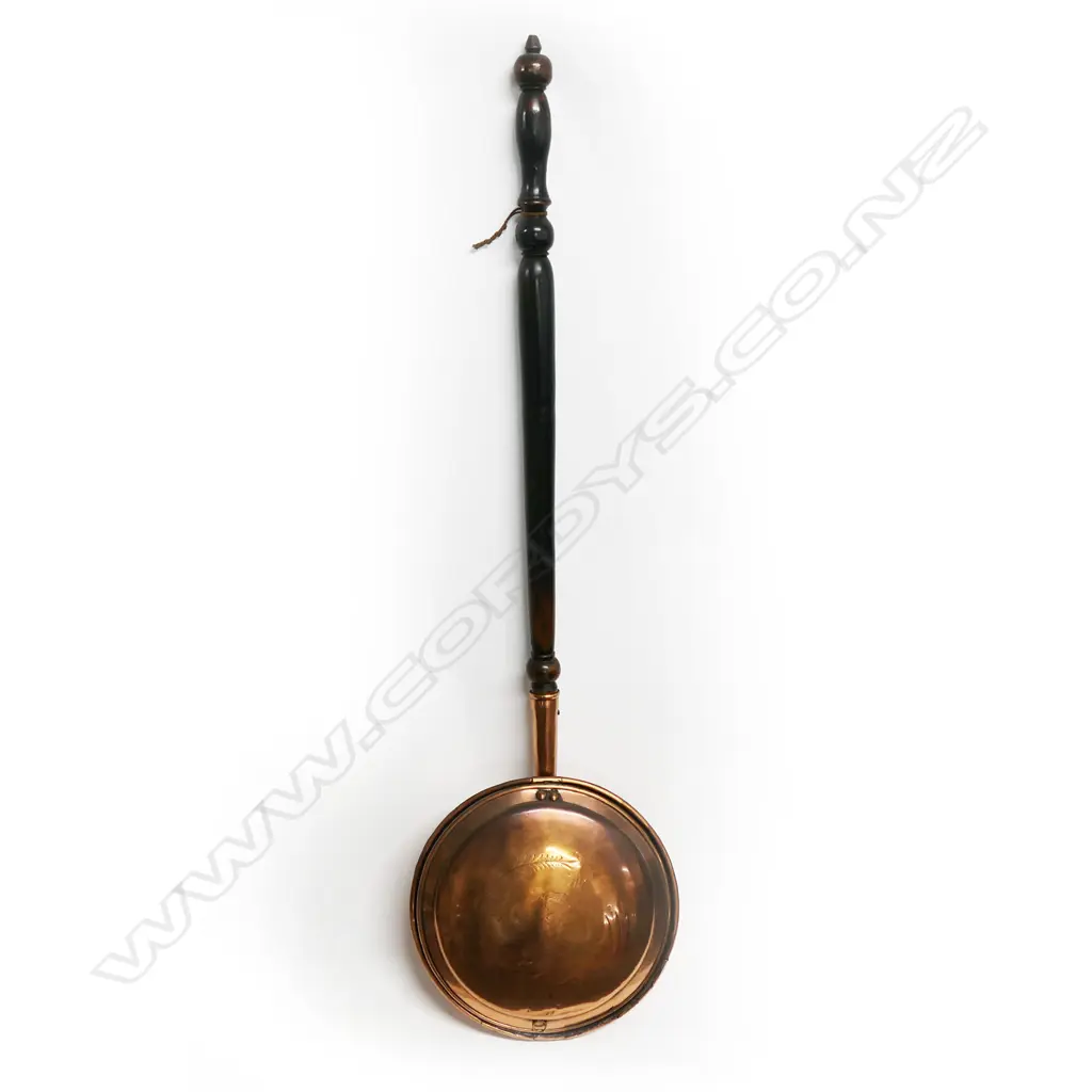 19thC copper bed warming pan engraved and with turned wooden handle: Ex. The collection of Valerie and John Robertson. Image 1++