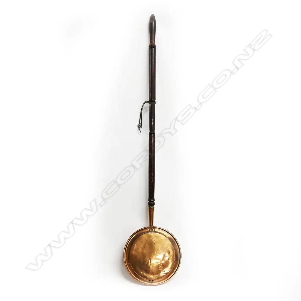 19thC copper bed warming pan engraved and with turned wooden handle: Ex. The collection of Valerie and John Robertson. Image 1++