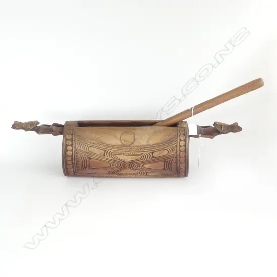 A WOODEN P.N,G DRUM WITH DRUM STICK L 670 MM