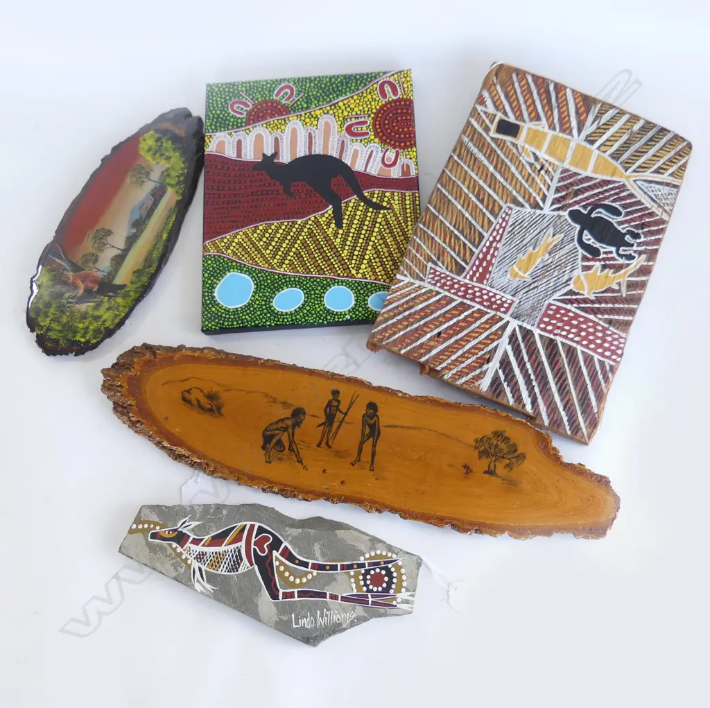 FIVE  ABORIGINAL ART DECORATIONS, 3  WOOD, 1 CANVAS AND ONE STONE, LONGEST 450MM Image 1++