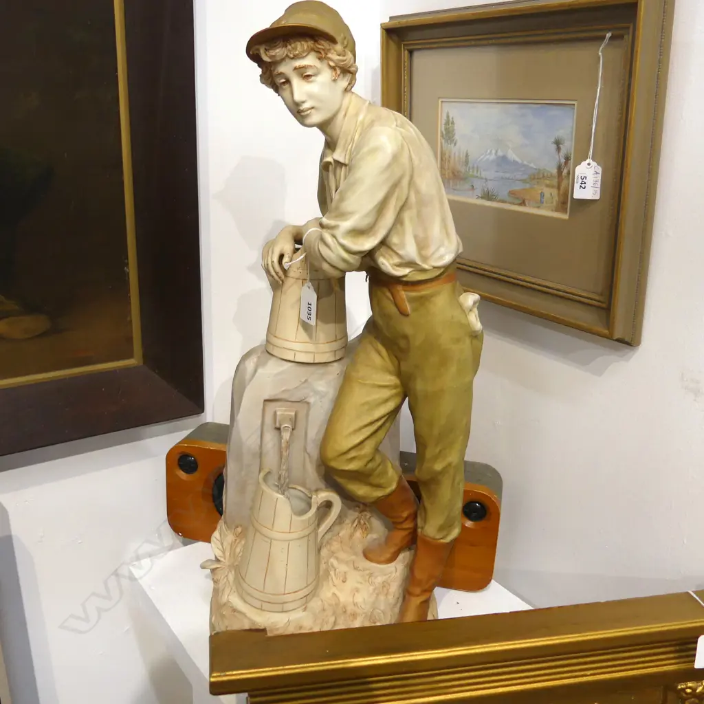 LGE ROYAL DUX FIGURE OF A YOUNG MAN AT THE WELL bisque porcelain gilded & soft toned H.600mm minor chipping to base Image 1++