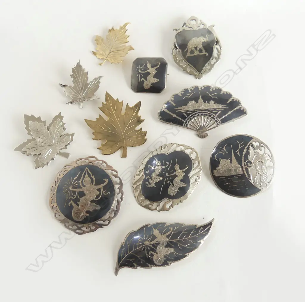 11 STG BROOCHES; 7 THAI + 4 BONDBOYD LEAVES 75gms Image 1++