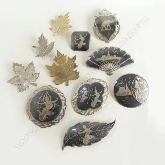 11 STG BROOCHES; 7 THAI + 4 BONDBOYD LEAVES 75gms