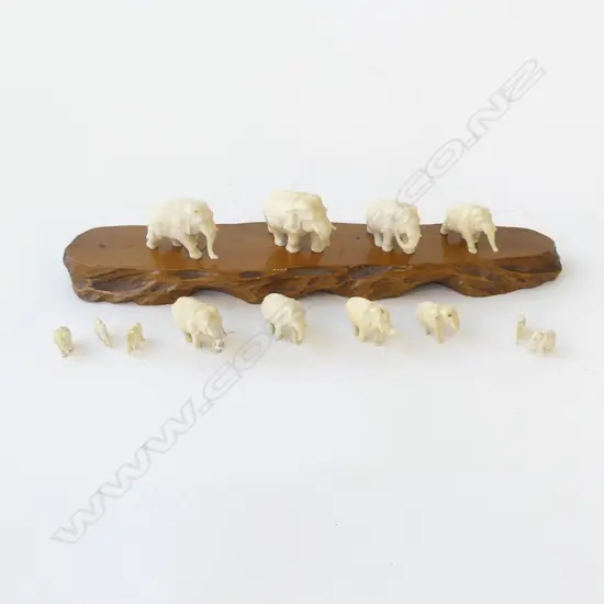 13 BONE OR IVORY? ELEPHANTS WITH A WOODEN STAND L.250mm