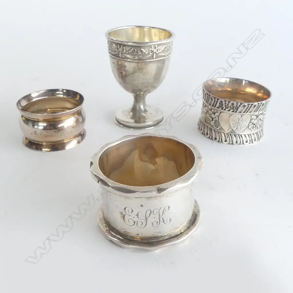 3 SILVER NAPKIN RINGS & SILVER EGG CUP. 146gms. 1 napkin ring of heavy cast quality Image 1++