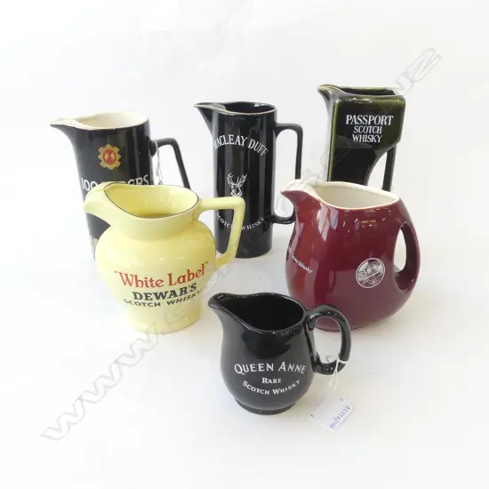 COLLECTION OF 6 WHISKY JUGS H200 TALLEST