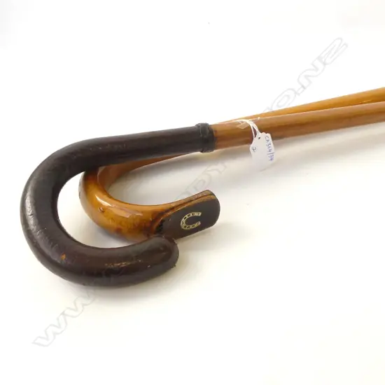 TWO WALKING STICKS – MALACA CANE WITH LEATHER HANDLE, & ONE WITH HORSESHOE INSERT GOLD?, H.870MM-920MM