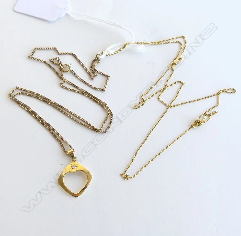 18ct DIAMOND PENDANT 1.8gms ON PLATED CHAIN + 14CT NECKLACE 2.2gms Image 1++