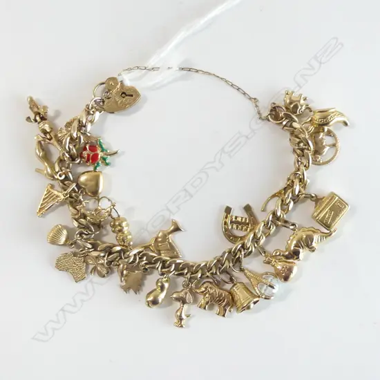 9ct GOLD CHARM BRACELET 33.9gms