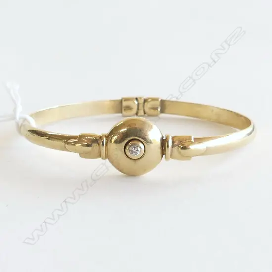 9ct YELLOW GOLD HINGED BANGLE w single diamond 21.75gms