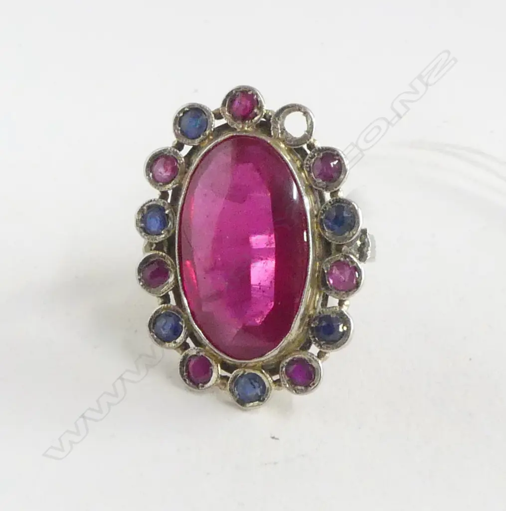 IMPRESSIVE 14 TO 18CT GOLD MULTI STONE RING synthetic center stone rubies & sapphires framing 1 missing 10.4gms Image 1++