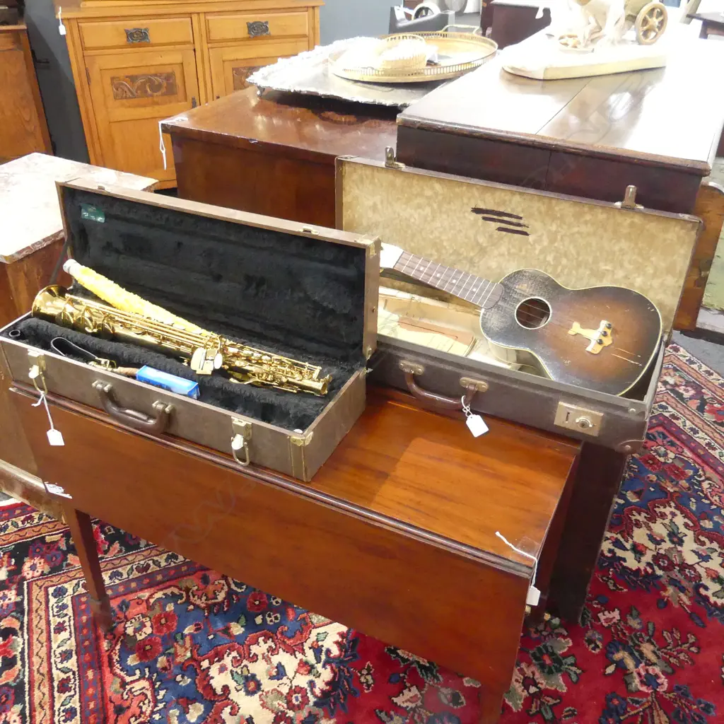 2 CASED INSTRUMENTS; UKELELE & WIND INSTRUMENT Image 1++