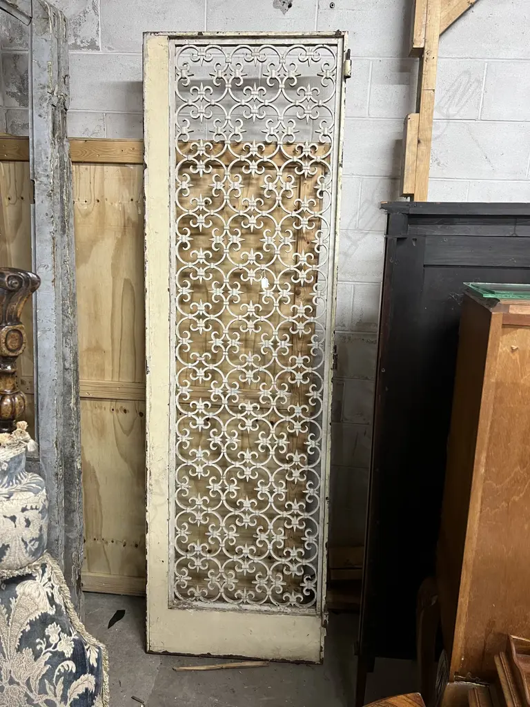 LGE SINGLE FRENCH METAL GRILLE DOOR. Scrolling quatrefoil motif repeating. In wood frame. 2275 x 690mm Image 1++