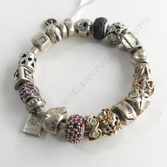 STG SILVER  AND GOLD CHARM BRACELET 67gms