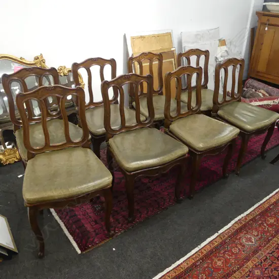 A set of eight oak dining chairs,