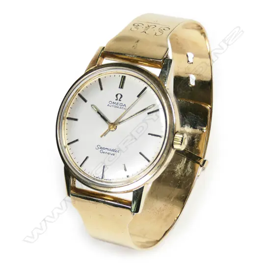 A vintage 9ct gold Omega Seamaster wristwatch with 9ct gold strap 58gms total,