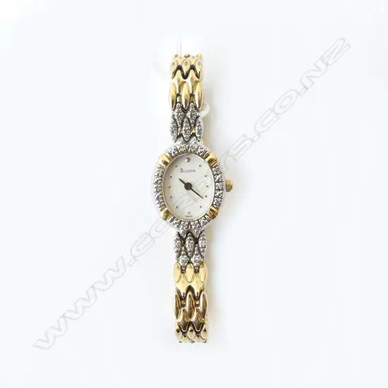 BULOVA LADIES WRISTWATCH  (small single cut diamonds set around dial)