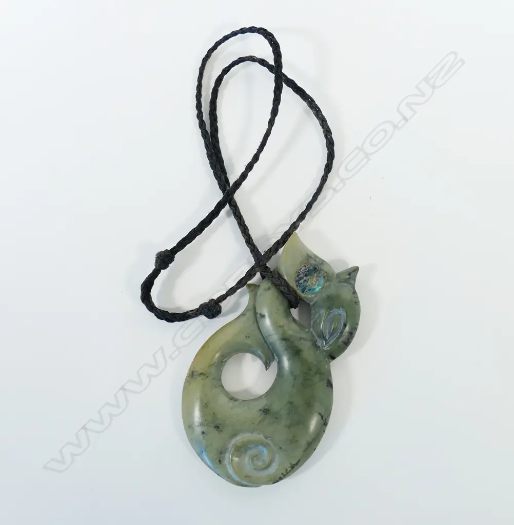 A contemporary large Māori Manaia carved pounamu pendant Image 1++