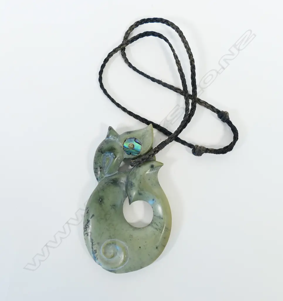 A contemporary large Māori Manaia carved pounamu pendant Image 1++
