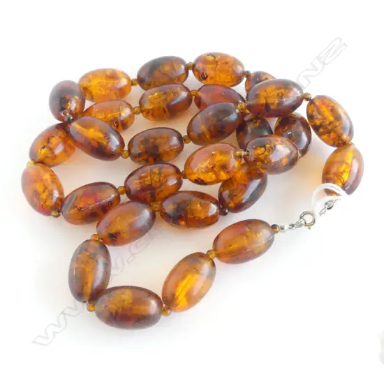 STRING OF AMBER-LIKE BEADS