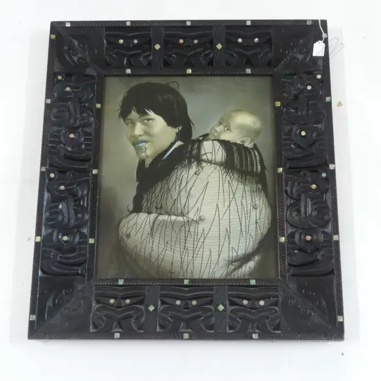 LINDAUER PRINT 'ANA RUPENE & CHILD' 455x380mm IN CARVED WOODEN FRAME, MAORI DESIGN w. PAUA INLAY 710x630mm
