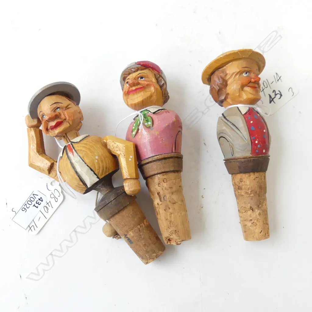 THREE CARVED GERMAN BLACK FOREST BOTTLE STOPS, ONE ARTICULATED MAN DOFFING HAT , A JOCKEY & GENTLEMEN WITH HAT (CHIP)  Image 1++