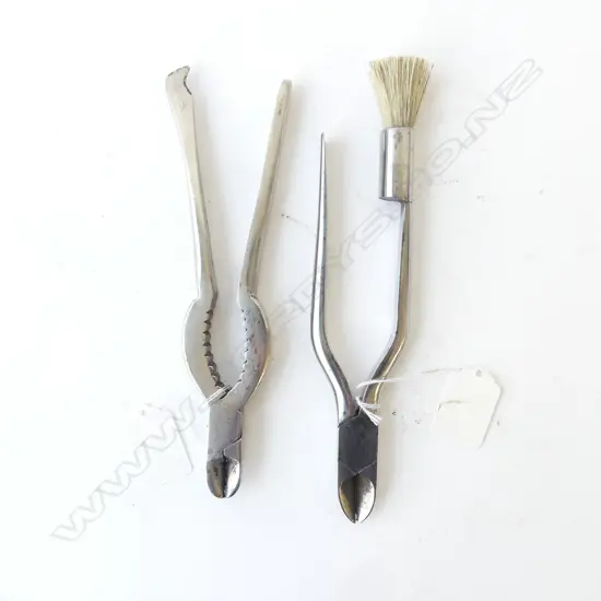 TWO OLD CHAMPAGNE PLIERS, ONE WITH END BRUSH, ENGRAVED WITH  'CTM 1902', L.190mm
