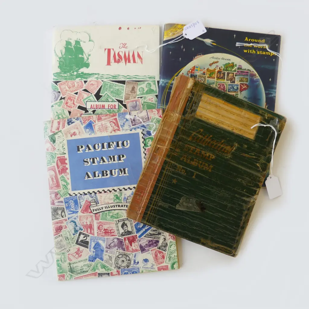 FOUR VINTAGE STAMP ALBUMS Image 1++