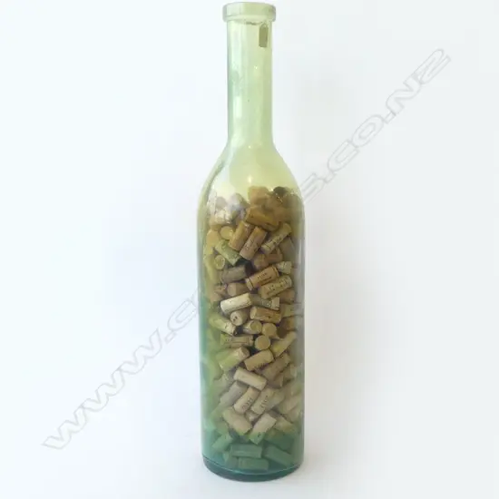 VERY TALL GREEN GLASS BOTTLE nearly full of corks H.750mm