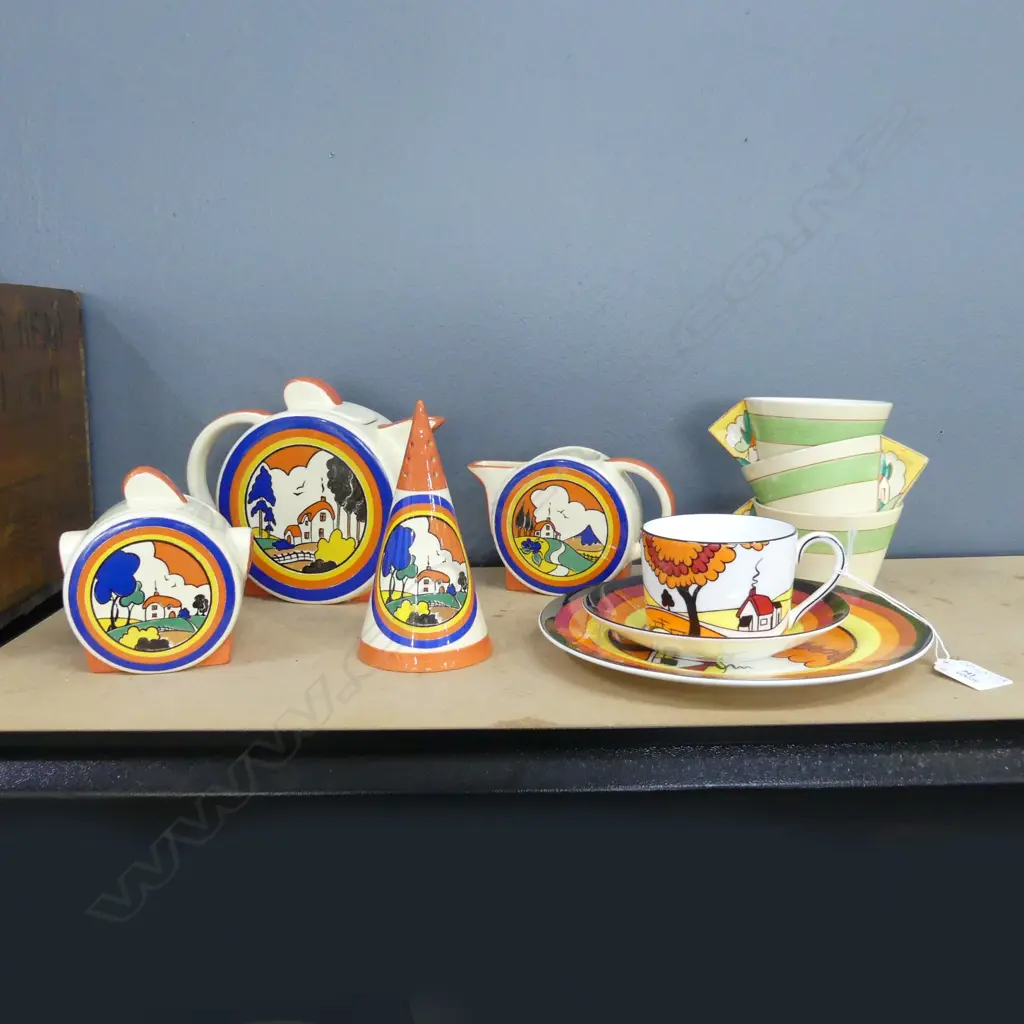 11 PCES CLARICE CLIFF; 3 BIZARRE CUPS, EGG HOLDER, REPRO WEGWOOD TRIO & 4 PCE MOORLAND STAFFORDSHIRE TEA SET Image 1++