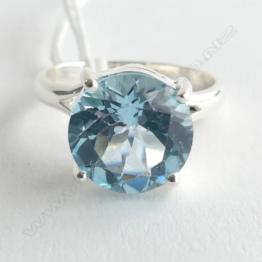 SILVER & BLUE TOPAZ RING, ROUND CUT IN RAISED SETTING SIZE U Image 1++