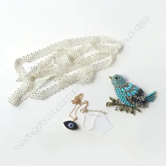A CZ ENCRUSTED SAUTOIR, EYE WARRIOR PENDANT & XL DIAMANTE & BEAD BIRD BROOCH