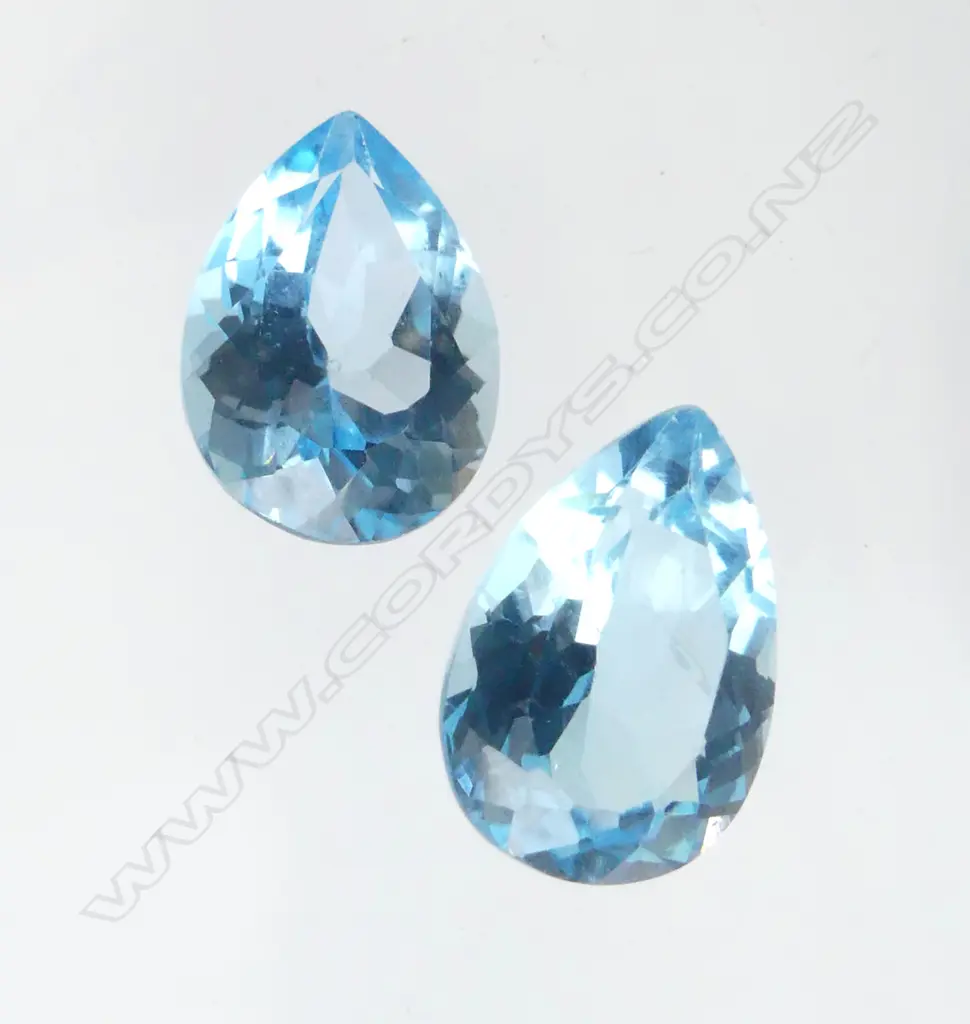 PAIR MATCHING UNSET BLUE TOPAZ 13.25ct, AIG CERT Image 1++