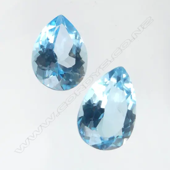PAIR MATCHING UNSET BLUE TOPAZ 13.25ct, AIG CERT