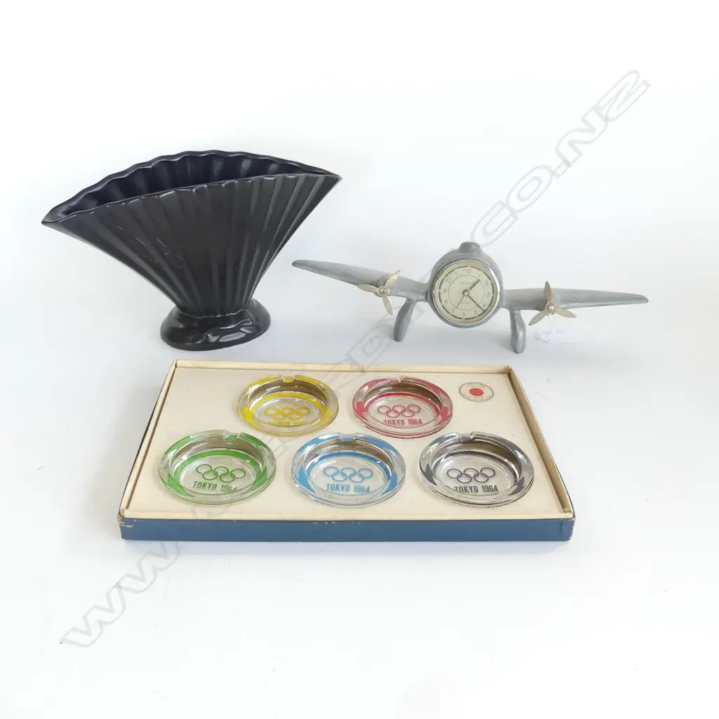 BLACK CERAMIC VASE H.160mm, METAL PLANE CLOCK W.340mm, 5 TOKYO OLYMPICS 1964 GLASS ASHTRAYS, BOXED Image 1++