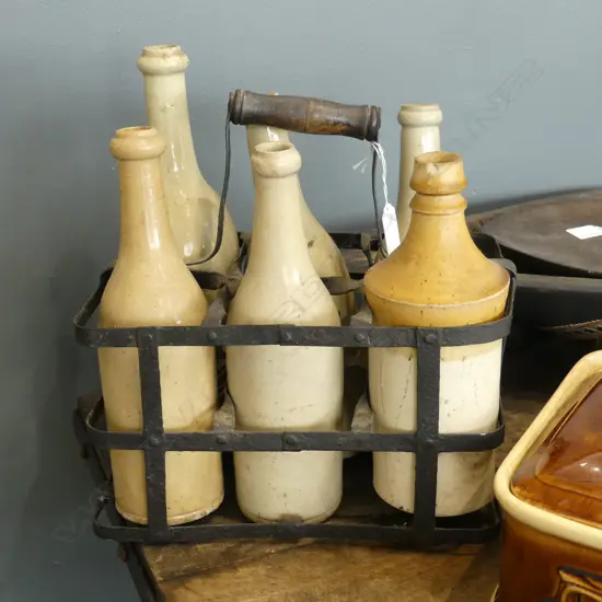 6 VINTAGE CERAMIC BOTTLES IN METAL HOLDER